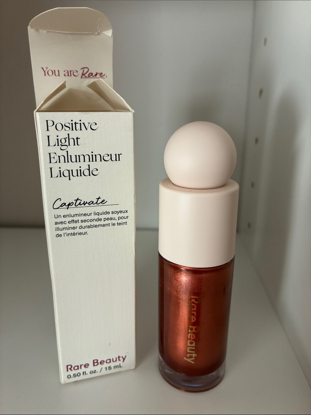 Rare Beauty Positive Light Liquid Luminizer Captivate - Copper Shimmer